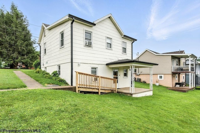 2300 Pride Ave, Clarksburg, WV 26301 - back of house featuring a deck and a lawn
