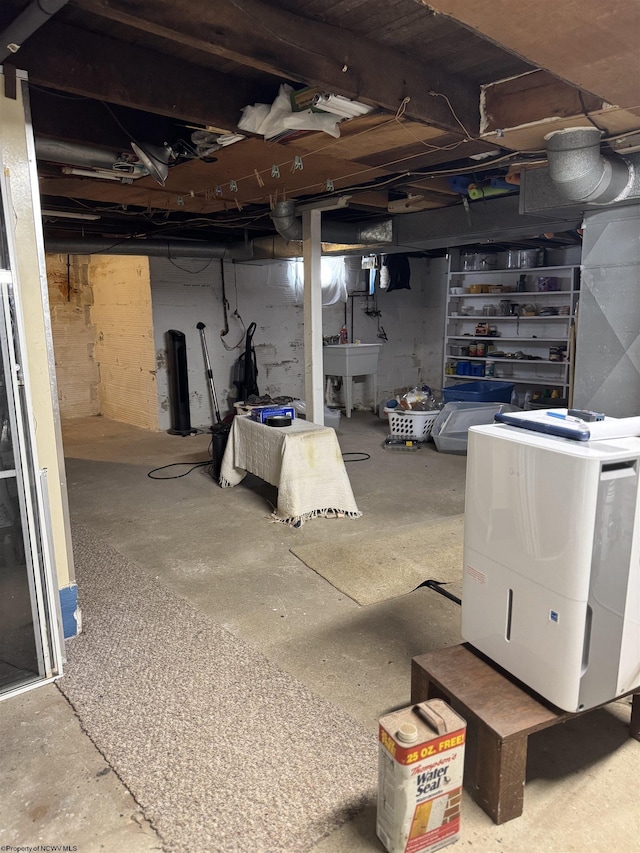 506 Broad St, Weston, WV 26452 - unfinished below grade area featuring washer and clothes dryer and a sink