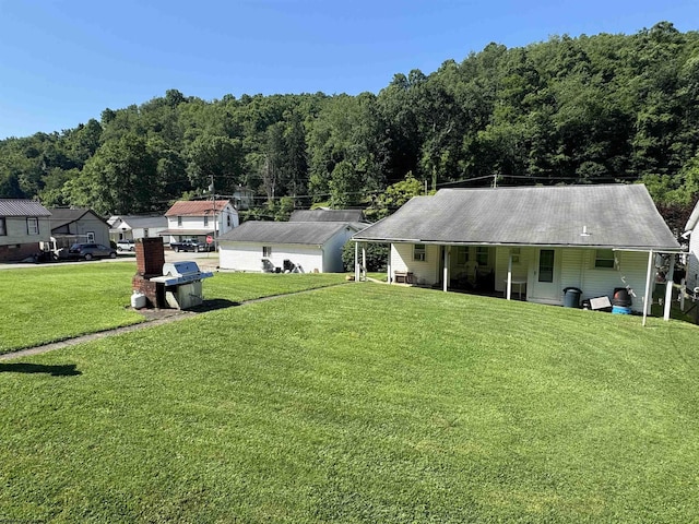 506 Broad St, Weston, WV 26452 - view of front of property featuring a front yard and a forest view
