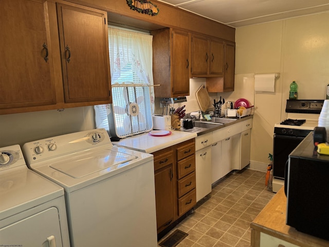 506 Broad St, Weston, WV 26452 - kitchen featuring washer and clothes dryer, gas stove, light countertops, and brown cabinets