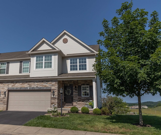 211 Berkshire Cir, Bridgeport, WV 26330 - view of front of property featuring driveway, a garage, stone siding, and a front lawn