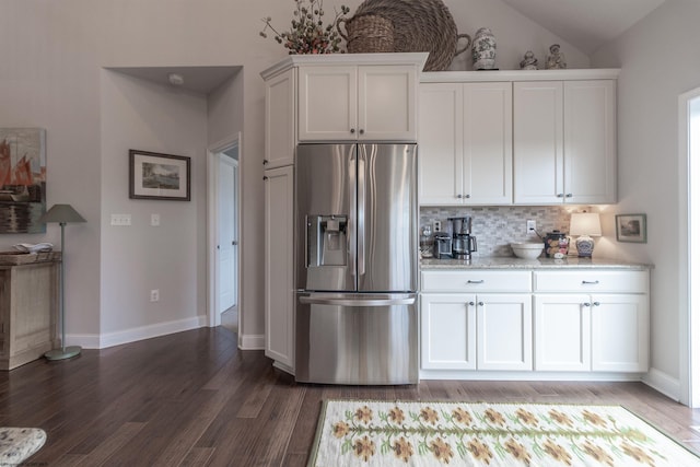 211 Berkshire Cir, Bridgeport, WV 26330 - kitchen featuring stainless steel fridge, white cabinets, backsplash, light wood-type flooring, and vaulted ceiling