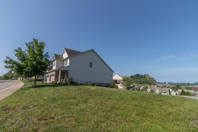 211 Berkshire Cir, Bridgeport, WV 26330 - view of side of home with a lawn and a garage