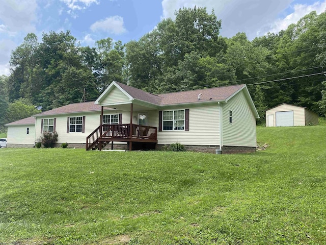 52 Ladder Dr, Mount Clare, WV 26408 - back of property with a detached garage, a wooden deck, an outbuilding, and a lawn