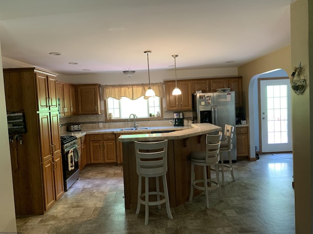 52 Ladder Dr, Mount Clare, WV 26408 - kitchen with appliances with stainless steel finishes, light countertops, backsplash, and a kitchen island