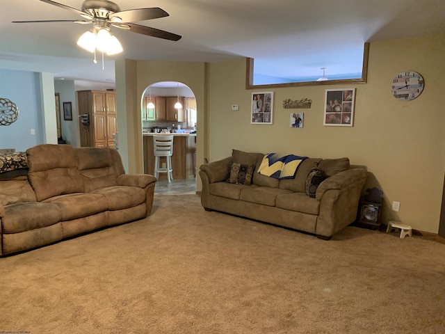 52 Ladder Dr, Mount Clare, WV 26408 - living area featuring arched walkways, a ceiling fan, and light colored carpet
