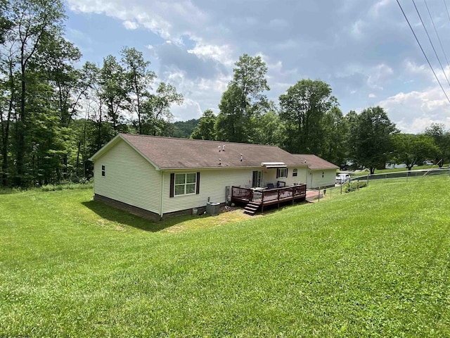 52 Ladder Dr, Mount Clare, WV 26408 - rear view of house with a wooden deck, a lawn, and roof with shingles