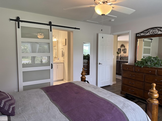 114 Snowy Ridge Rd, Terra Alta, WV 26764 - bedroom with a barn door, ensuite bathroom, ceiling fan, and dark wood finished floors