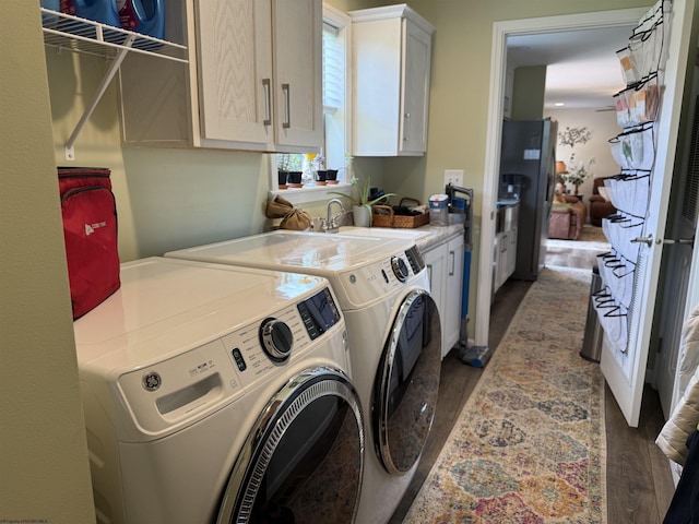 114 Snowy Ridge Rd, Terra Alta, WV 26764 - laundry area with cabinet space, separate washer and dryer, and wood finished floors