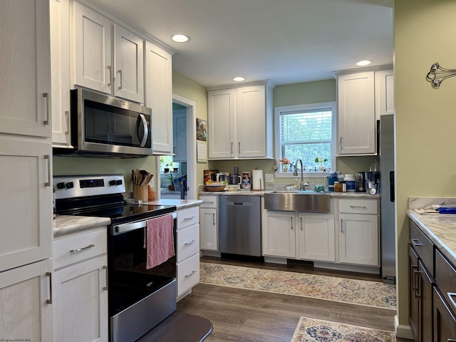 114 Snowy Ridge Rd, Terra Alta, WV 26764 - kitchen with stainless steel appliances, light countertops, recessed lighting, dark wood-style floors, and white cabinets