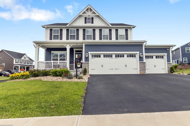 204 Falling Water Ln, Morgantown, WV 26508 - craftsman inspired home with stone siding, driveway, a front lawn, and a porch