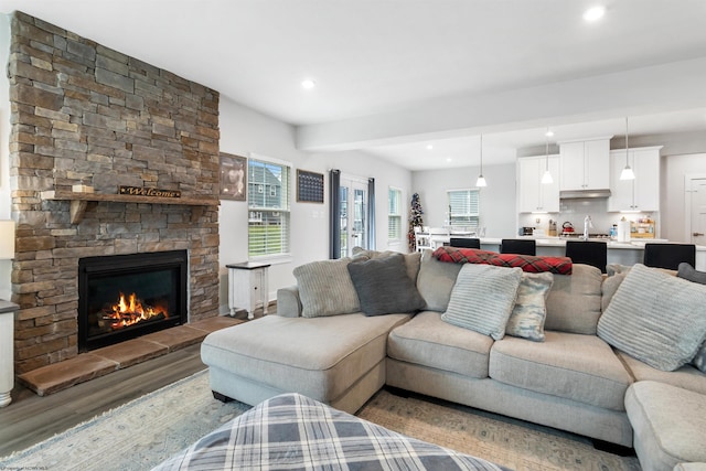 204 Falling Water Ln, Morgantown, WV 26508 - living area with wood finished floors, plenty of natural light, recessed lighting, and a fireplace
