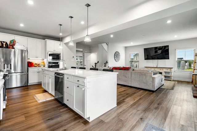 204 Falling Water Ln, Morgantown, WV 26508 - kitchen with stainless steel appliances, recessed lighting, dark wood finished floors, white cabinets, and healthy amount of natural light