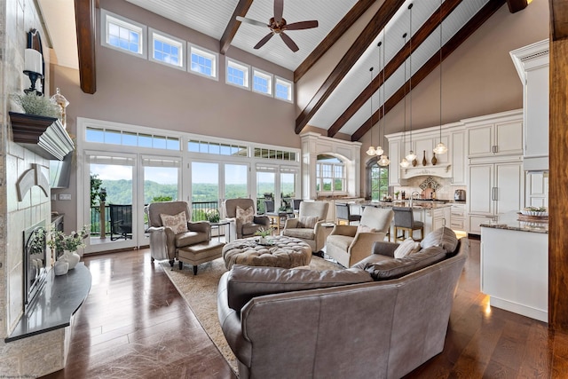 1009 Summit Dr, Morgantown, WV 26508 - living area featuring high vaulted ceiling, a ceiling fan, beam ceiling, healthy amount of natural light, and dark wood-style floors