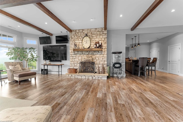 1009 Summit Dr, Morgantown, WV 26508 - living area featuring wood finished floors, beam ceiling, a fireplace, and recessed lighting