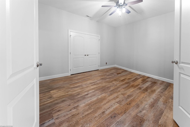 1009 Summit Dr, Morgantown, WV 26508 - unfurnished bedroom featuring wood finished floors and a ceiling fan