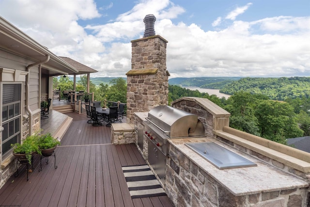 1009 Summit Dr, Morgantown, WV 26508 - wooden terrace featuring exterior kitchen and outdoor dining space
