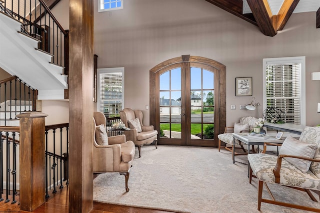 1009 Summit Dr, Morgantown, WV 26508 - living area featuring french doors, a high ceiling, beamed ceiling, stairway, and carpet flooring