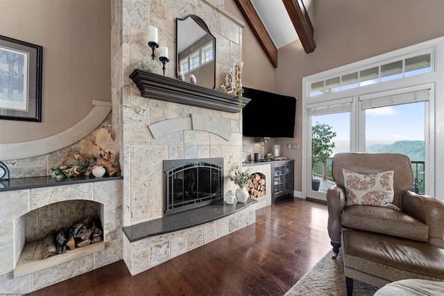 1009 Summit Dr, Morgantown, WV 26508 - living area with a fireplace, beam ceiling, dark wood-style floors, and high vaulted ceiling