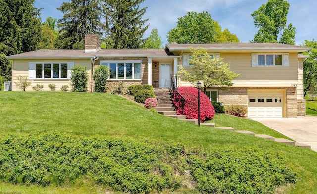 1348 Anderson Ave, Morgantown, WV 26505 - tri-level home featuring an attached garage, driveway, a chimney, a front lawn, and stone siding