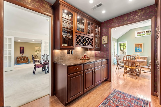 1348 Anderson Ave, Morgantown, WV 26505 - indoor dry bar featuring light wood-style floors, backsplash, vaulted ceiling, and recessed lighting