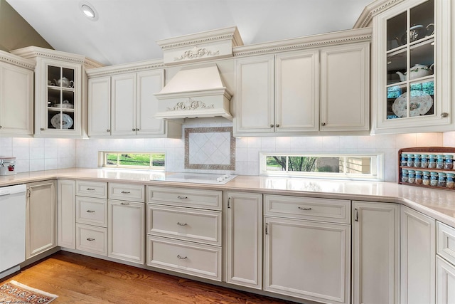 1348 Anderson Ave, Morgantown, WV 26505 - kitchen with premium range hood, white dishwasher, light countertops, lofted ceiling, and decorative backsplash