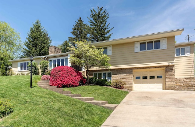 1348 Anderson Ave, Morgantown, WV 26505 - view of front of property featuring driveway, a front yard, a garage, and stone siding