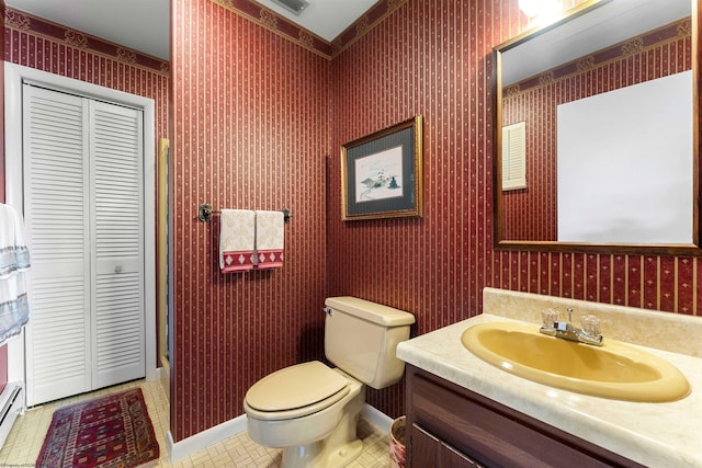 1348 Anderson Ave, Morgantown, WV 26505 - bathroom featuring vanity, a closet, and wallpapered walls