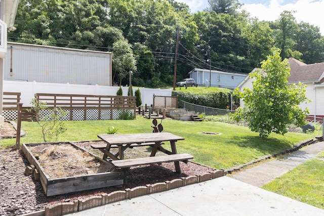 42 Crummitt Ln, Clarksburg, WV 26301 - fenced backyard featuring a garden