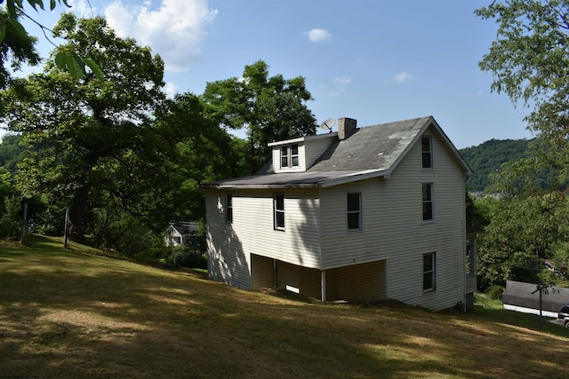 132 Racine St, Morgantown, WV 26505 - view of property exterior with a yard and a chimney