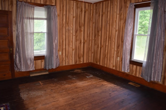 132 Racine St, Morgantown, WV 26505 - unfurnished room with wood-type flooring, healthy amount of natural light, and wooden walls