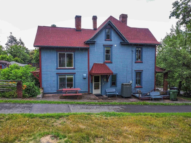 200 Webster Ave, Morgantown, WV 26501 - victorian-style house featuring a chimney, a front lawn, and a patio area