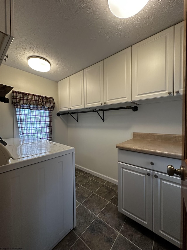 1218 N 18th St, Clarksburg, WV 26301 - washroom with washer / dryer, dark tile patterned flooring, cabinet space, and a textured ceiling