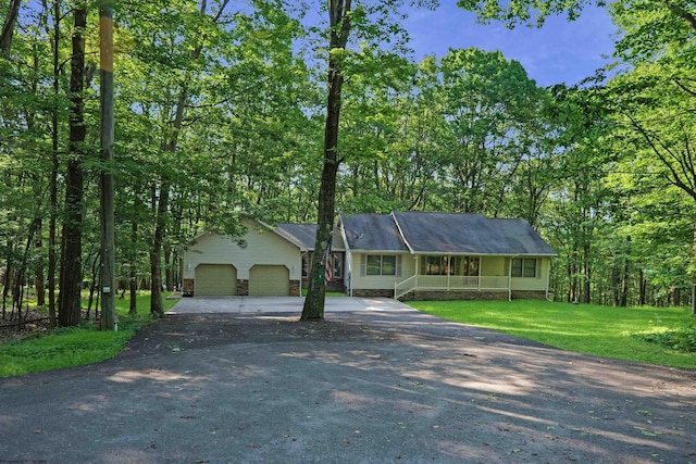 6 Sorrel Ct, Terra Alta, WV 26764 - view of front of property featuring a porch, asphalt driveway, an attached garage, and a front yard