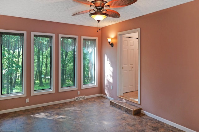 6 Sorrel Ct, Terra Alta, WV 26764 - unfurnished room with plenty of natural light, ceiling fan, and a textured ceiling