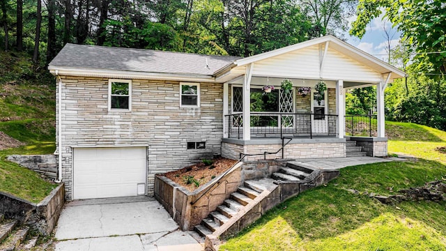 552 White Ave, Morgantown, WV 26501 - single story home with stone siding, covered porch, an attached garage, a front lawn, and driveway