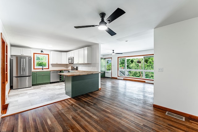 552 White Ave, Morgantown, WV 26501 - kitchen with stainless steel appliances, green cabinets, wood counters, a ceiling fan, and white cabinetry