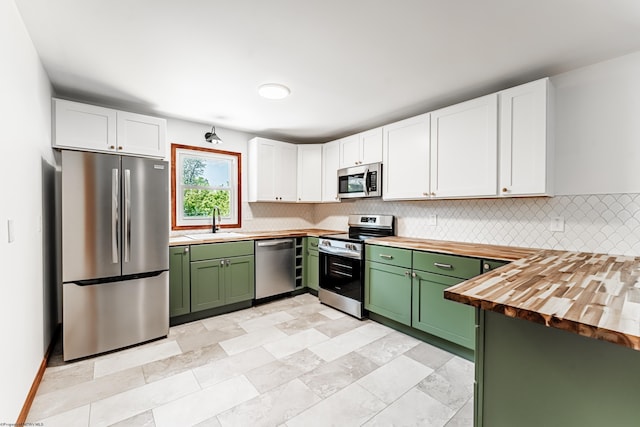 552 White Ave, Morgantown, WV 26501 - kitchen featuring appliances with stainless steel finishes, green cabinetry, butcher block countertops, and tasteful backsplash