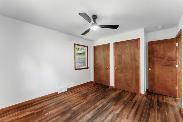 552 White Ave, Morgantown, WV 26501 - unfurnished bedroom with wood-type flooring, multiple closets, and ceiling fan