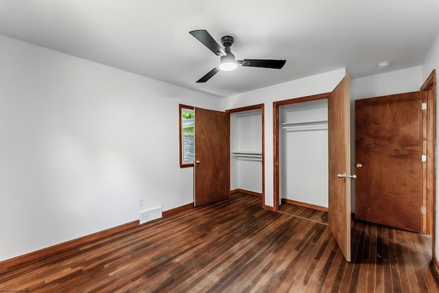 552 White Ave, Morgantown, WV 26501 - unfurnished bedroom with dark wood-type flooring, a ceiling fan, and multiple closets