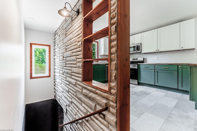 552 White Ave, Morgantown, WV 26501 - kitchen featuring appliances with stainless steel finishes, green cabinets, white cabinetry, and tasteful backsplash
