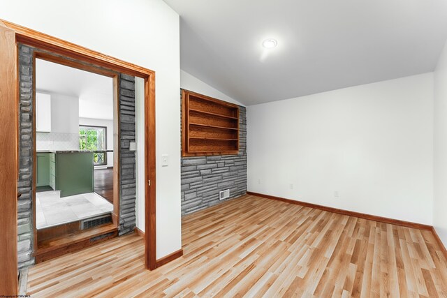 552 White Ave, Morgantown, WV 26501 - unfurnished bedroom featuring lofted ceiling and light wood-type flooring