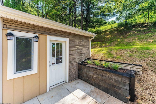 552 White Ave, Morgantown, WV 26501 - doorway to property with stone siding and view of scattered trees