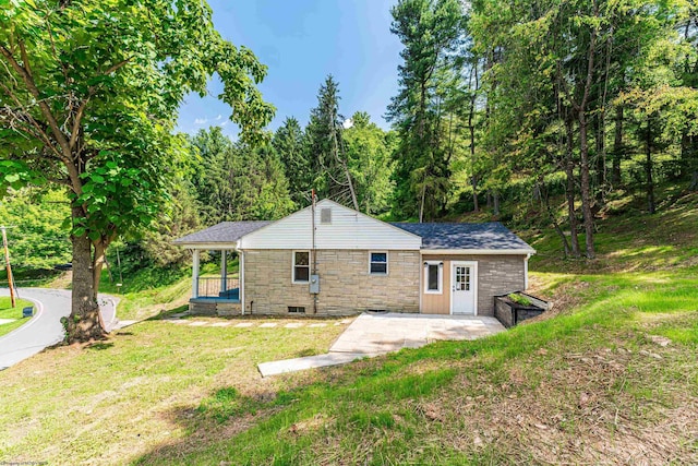 552 White Ave, Morgantown, WV 26501 - rear view of property featuring a yard, stone siding, a wooded view, and a patio