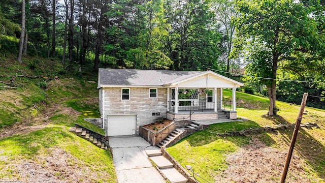 552 White Ave, Morgantown, WV 26501 - ranch-style home featuring stone siding, covered porch, stairs, an attached garage, and concrete driveway