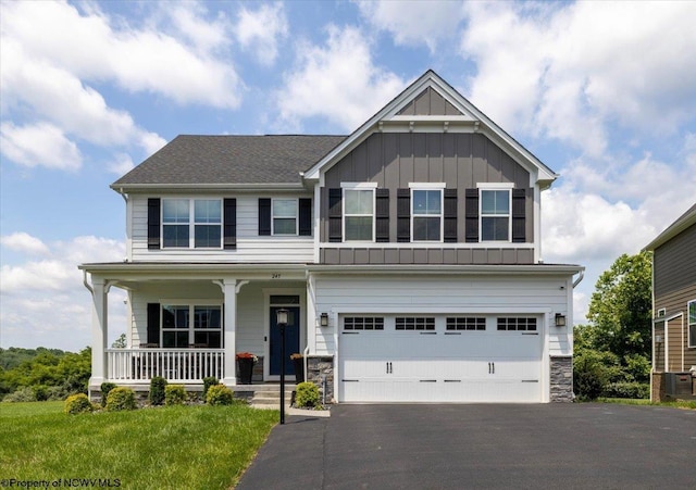 245 Falling Water Ln, Morgantown, WV 26508 - craftsman inspired home with board and batten siding, a porch, driveway, a garage, and stone siding