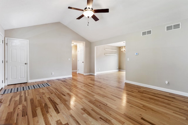 206 Angel Falls Way, Morgantown, WV 26508 - unfurnished living room featuring a ceiling fan, a chandelier, light wood finished floors, and lofted ceiling