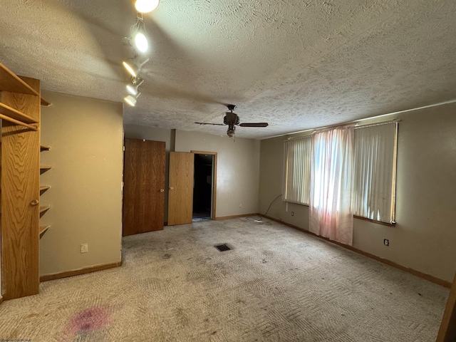 113 Buckhannon Ave, Clarksburg, WV 26301 - carpeted spare room featuring a textured ceiling and a ceiling fan