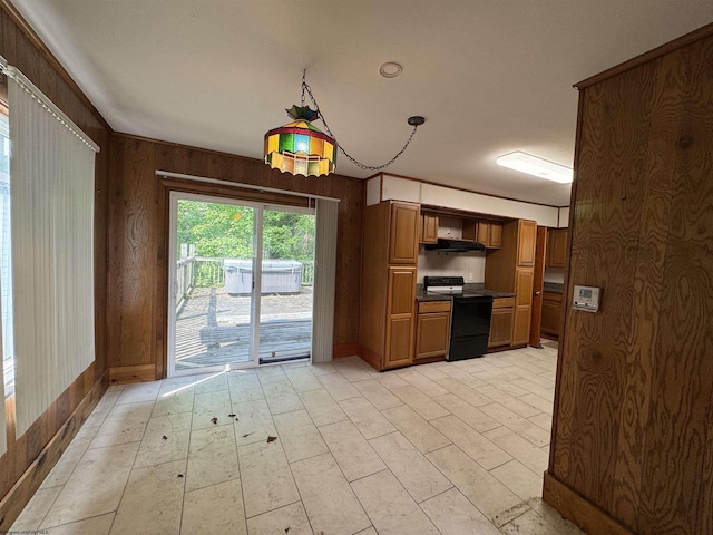 113 Buckhannon Ave, Clarksburg, WV 26301 - kitchen featuring electric range, wood walls, dark countertops, brown cabinetry, and under cabinet range hood