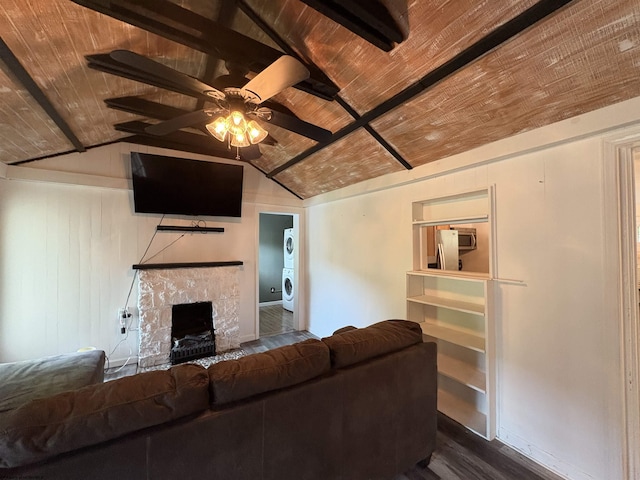 1998 Lake Floyd Cir, Bristol, WV 26426 - living room featuring estacked washer and dryer, wood ceiling, dark wood-type flooring, ceiling fan, and a stone fireplace